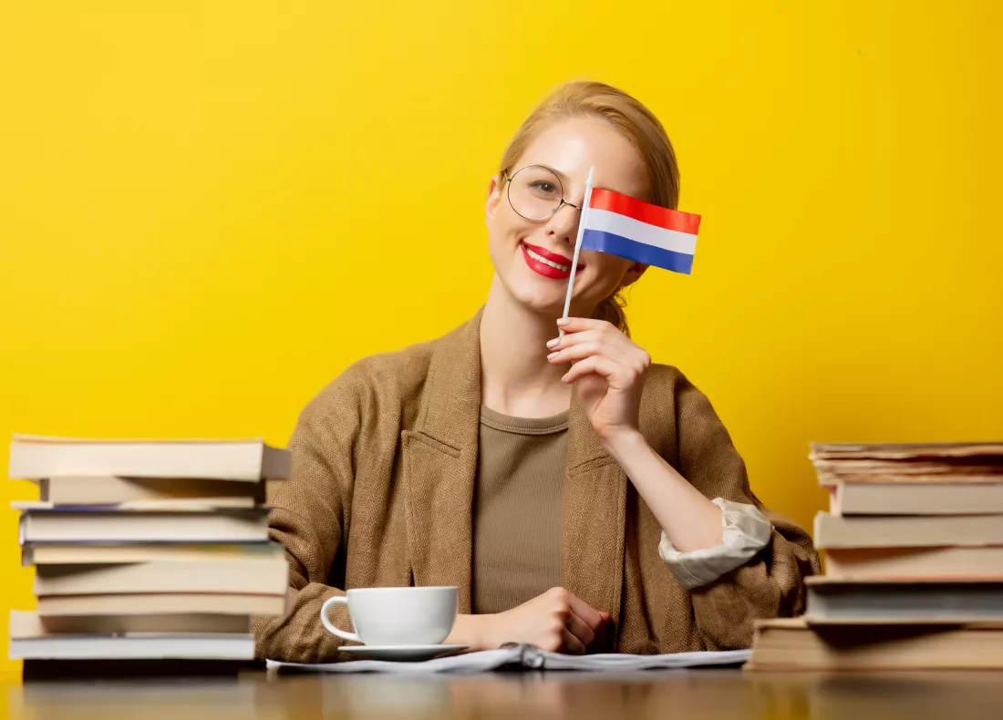 blonde-woman-with-flag-netherlands-books-yellow