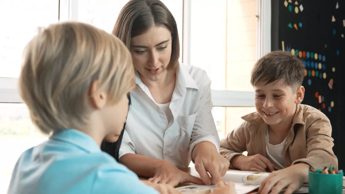 professional-caucasian-teacher-telling-story-diverse-student-erudition