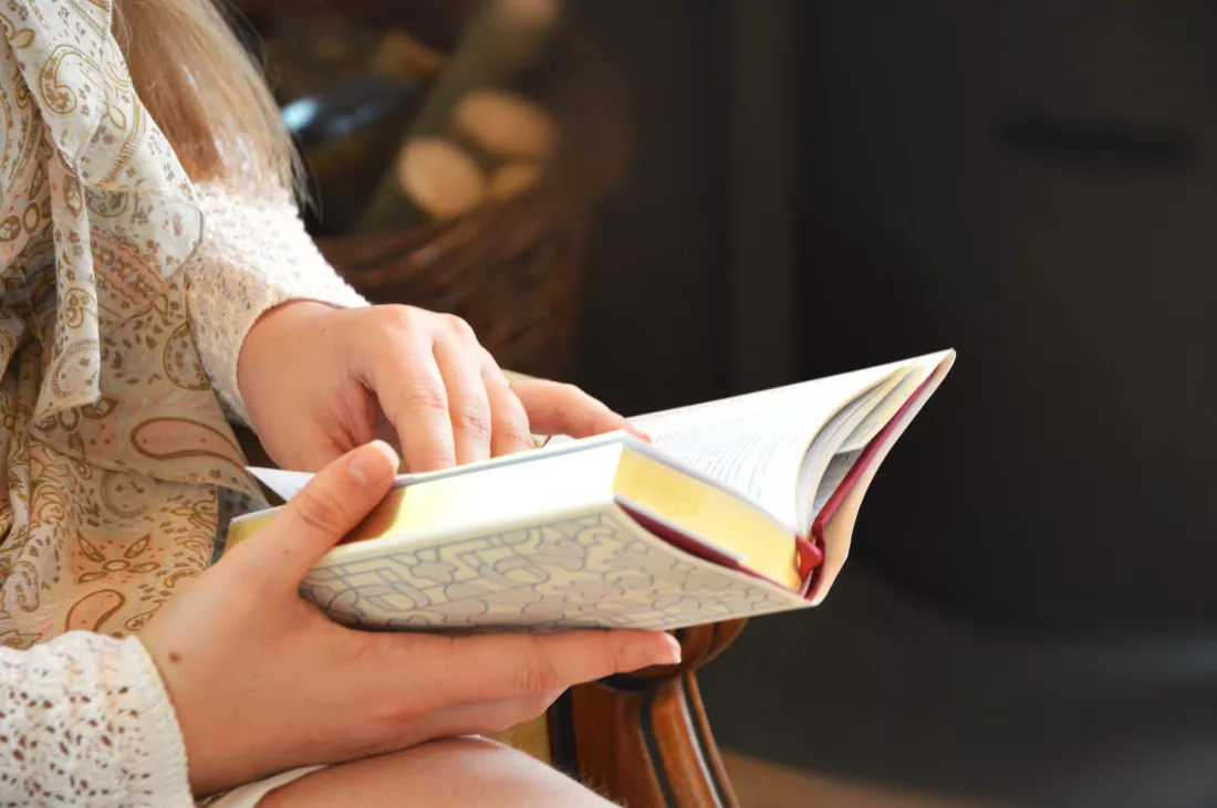 midsection-woman-holding-book