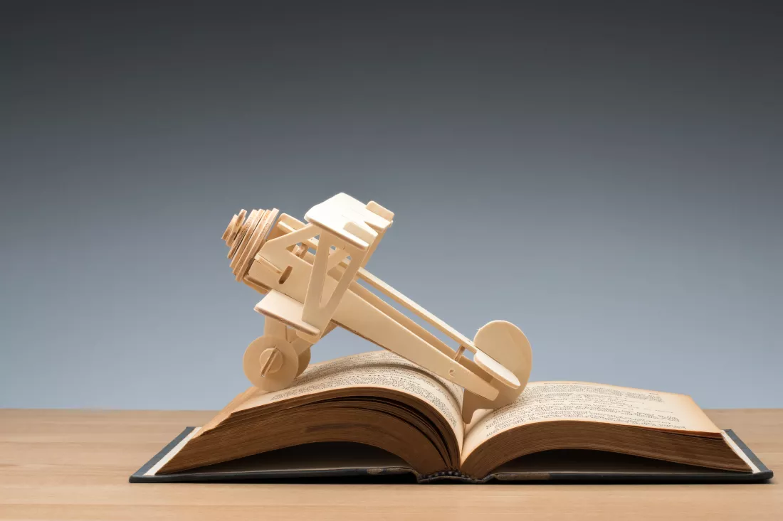close-up-model-airplane-book-table