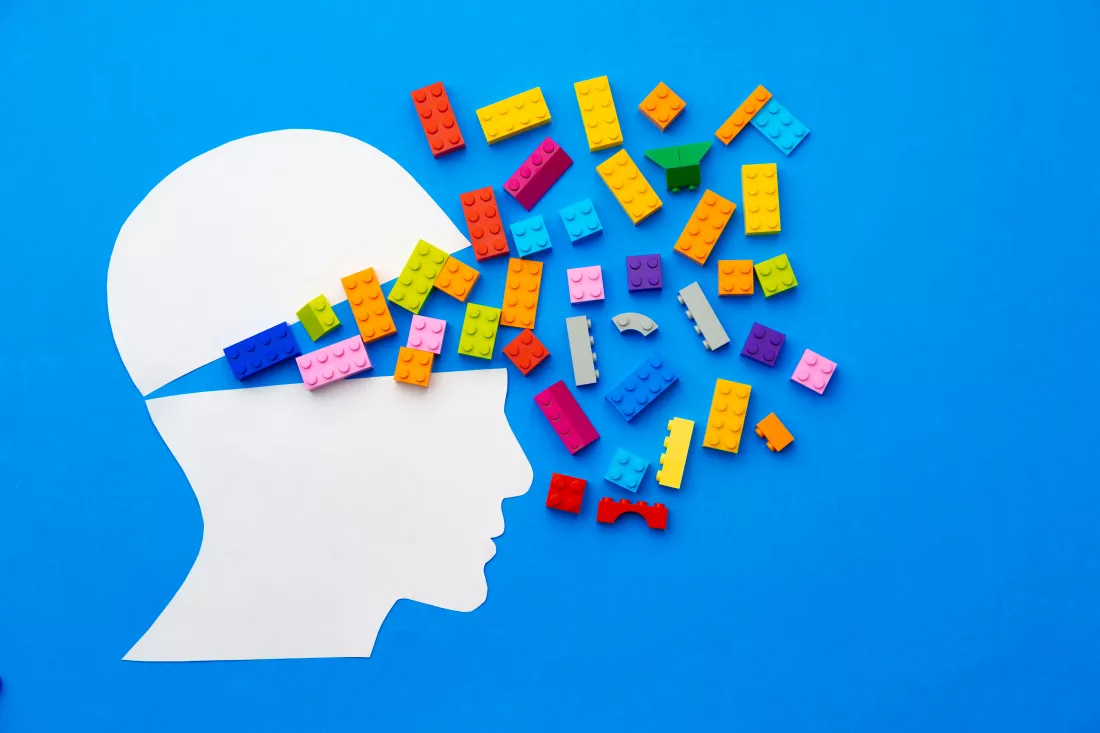 papercut-silhouette-human-head-with-colorful-constructor-pieces